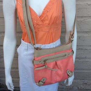 Charming Charlie cross-body bag in peachy pink/tan